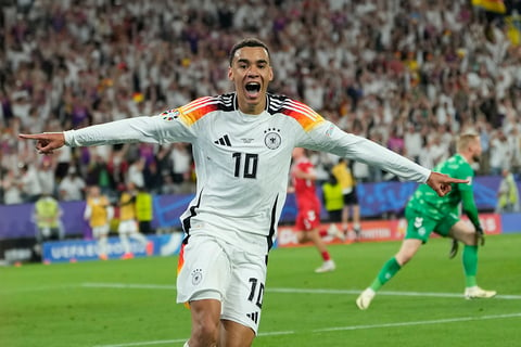 Jamal Musiala celebrates after scoring Germany's second goal